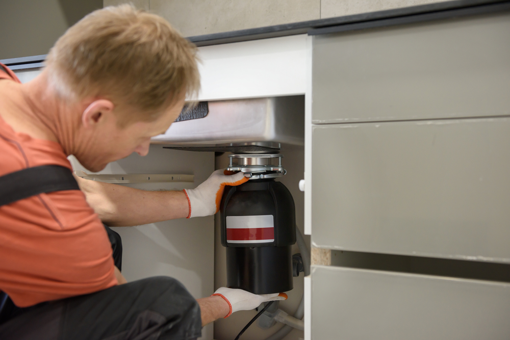 Photo of a Plumber Disposing Garbage